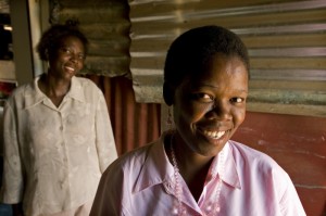 HIV/AIDS caregiver Lebogang Molefi, right, with her patient Maria Mogale, in South Africa’s North West Province. Molefi works for Pholo Modi Wa Sechaba, one of thousands of local community-based organizations dedicated to helping the country’s roughly 5.5 million people living with HIV/AIDS. Photo: Brett Eloff / Oxfam America